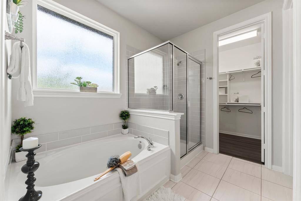 Stunning Primary Bath, Tiled Flooring, Large Garden Tub w/Rain Glass Window, Separate Tiled Shower, Large Well Lit Closet