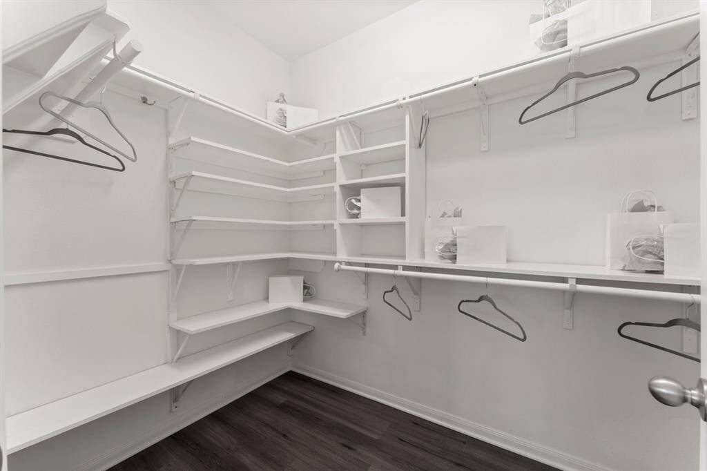 Primary Suite Closet with  Added Custom Shelves