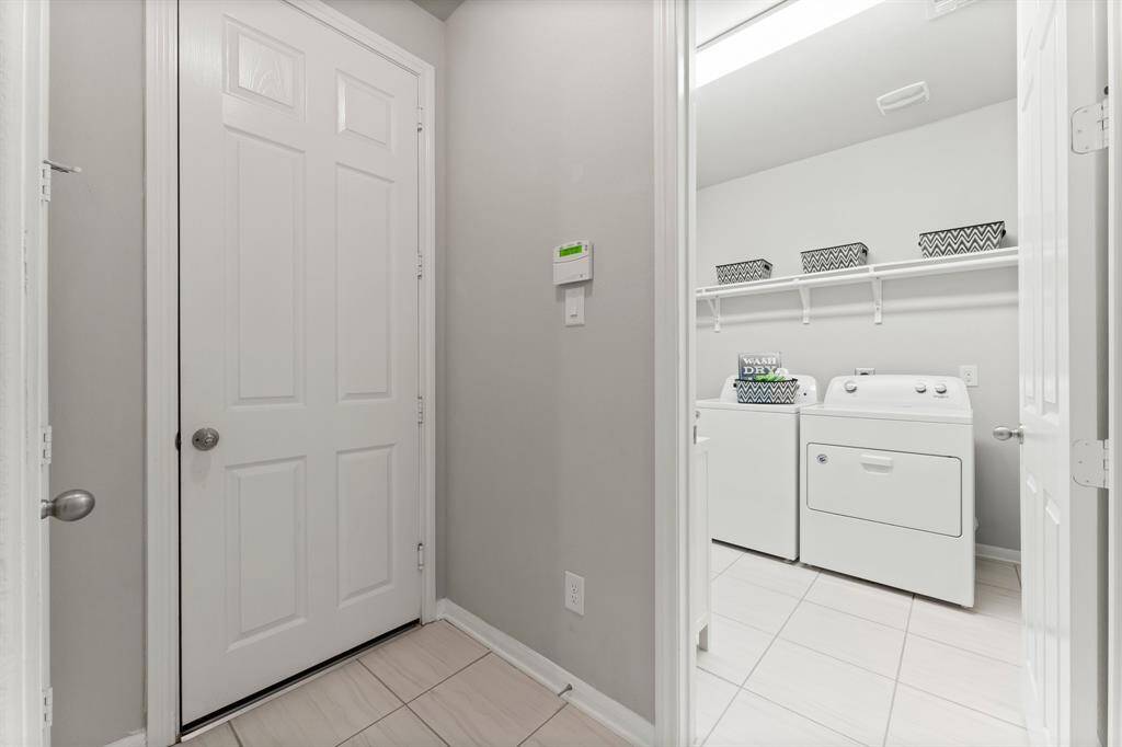 Entry from Garage and Spacious Utility Room