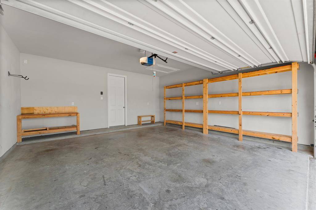2 Car Garage with Shelving, Insulated Garage Door and more...