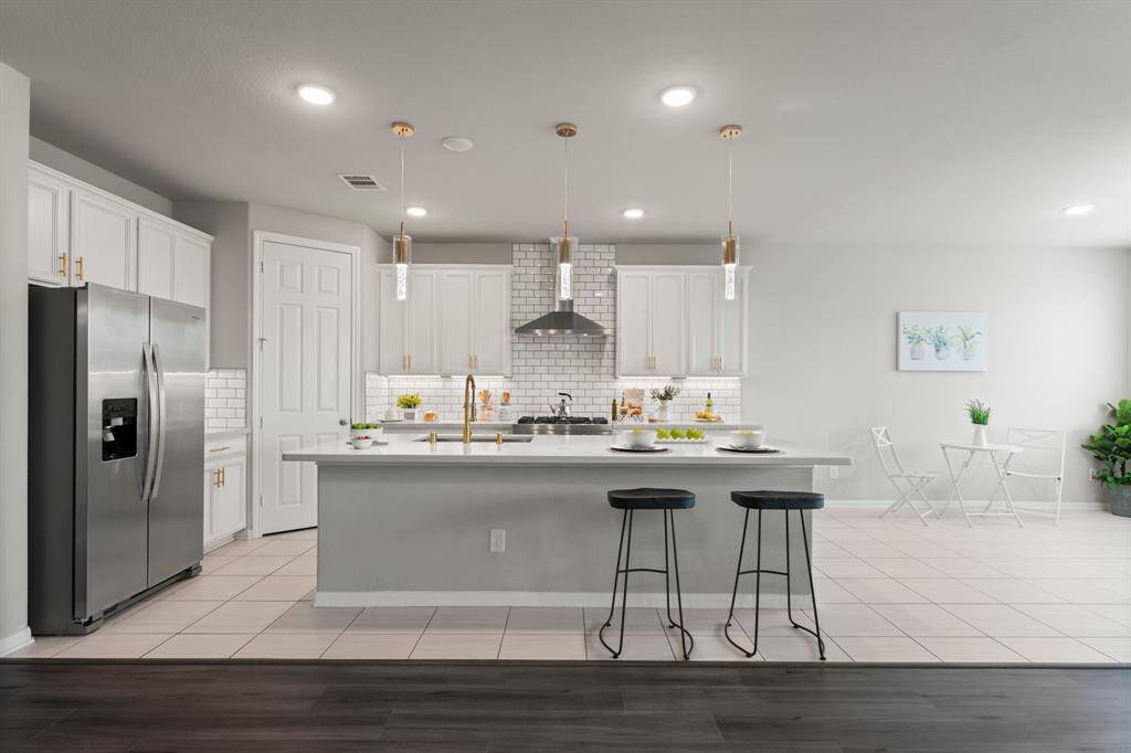 The Heart of the Home, This Fabulous Kitchen boasts a Large Island w/Bar Seating, Commercial Stainless Gas Range and So Much More...