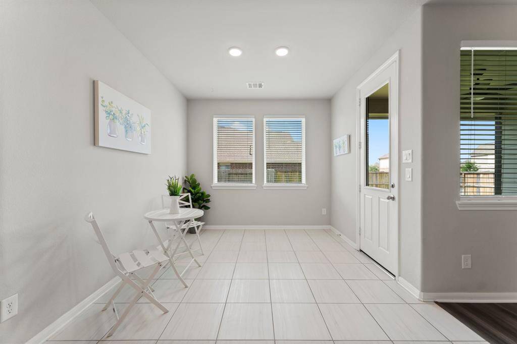 Light and Bright Breakfast Area Open to Kitchen and Living Room