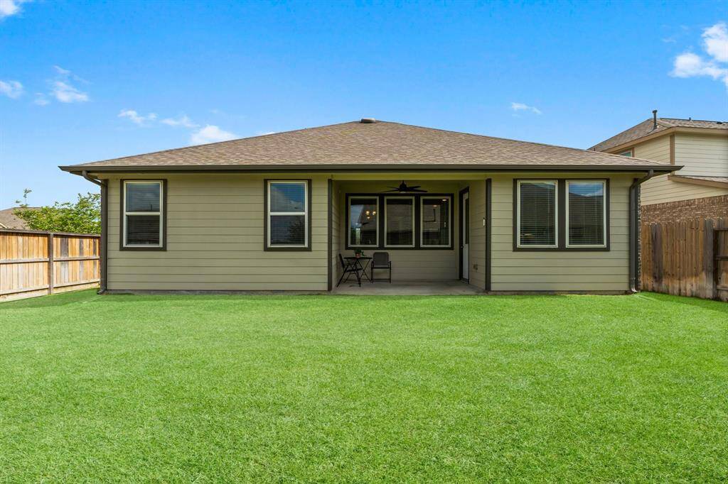 Enjoy Quiet Mornings or Peaceful Evenings on the Rear Covered Porch with Ceiling Fan.