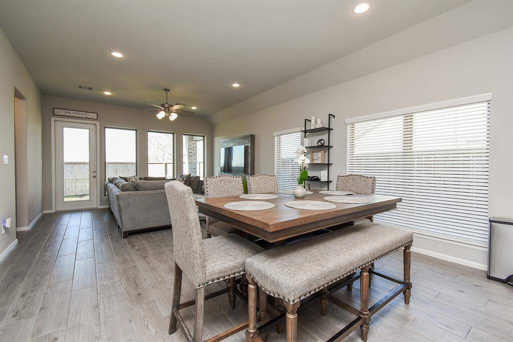 Upgraded wood tile throughout home everywhere except bedrooms and bathrooms