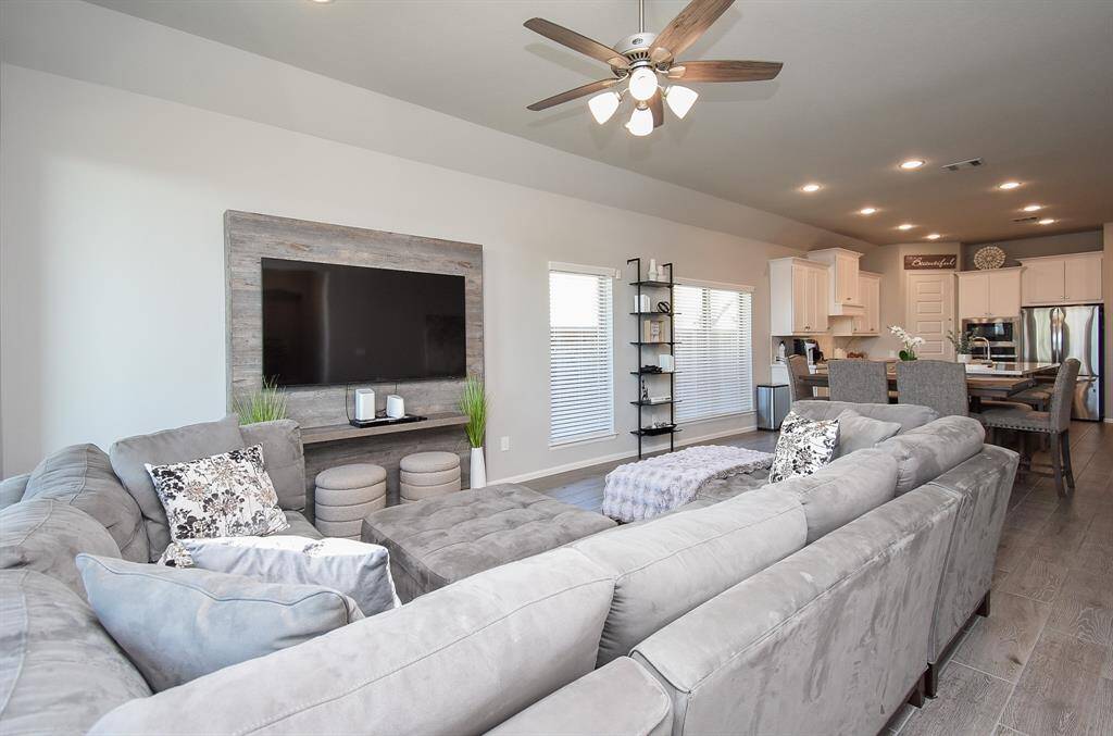 Spacious living room filled with natural light.