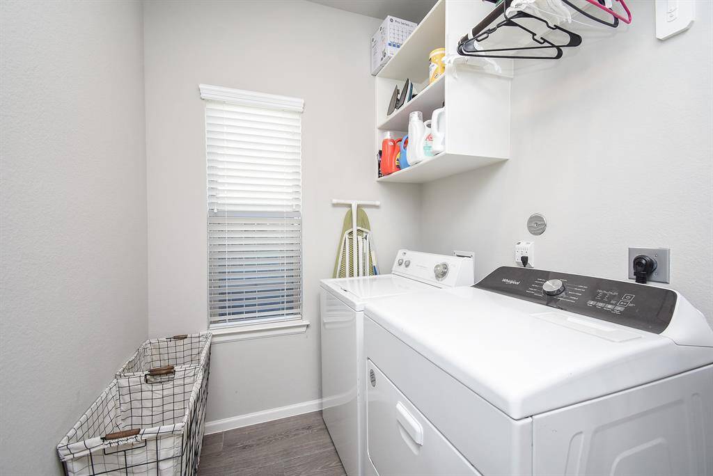 Big utility room has a space to the right of washer for a refrigerator or freezer