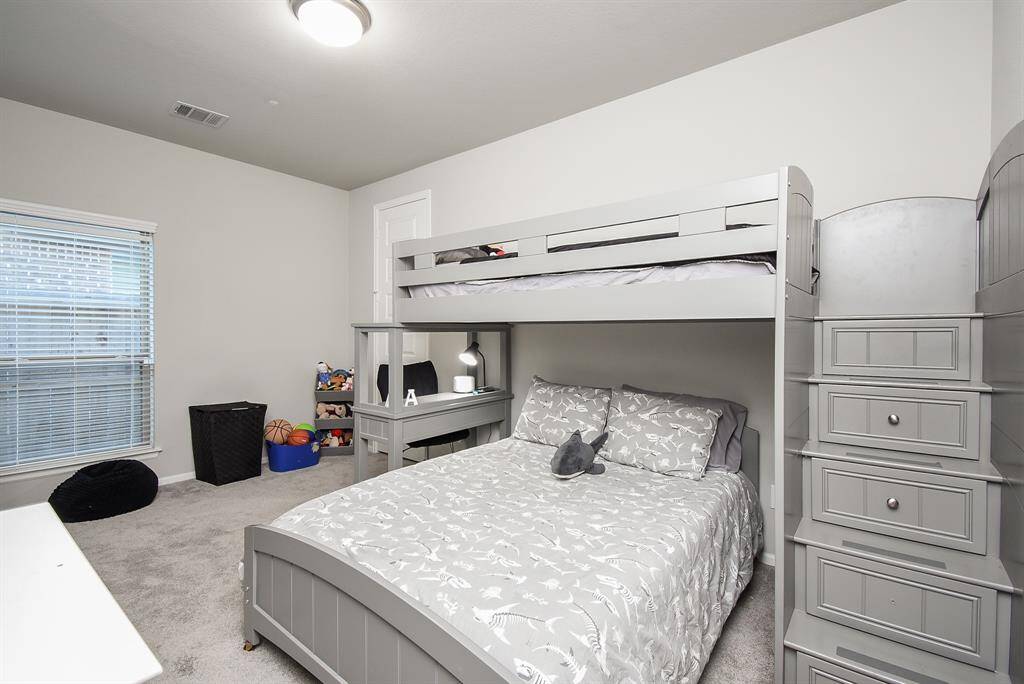 Biggest of the secondary bedrooms this spacious room is on the other side of the Jack and Jill bathroom