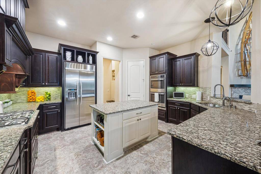 Stainless steel appliacnes and lots of room to move around the kitchen while cooking.