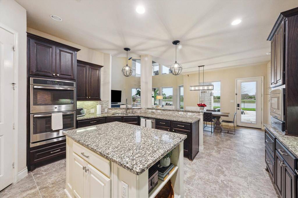 Kitchen features high-end stainless steal applianes.