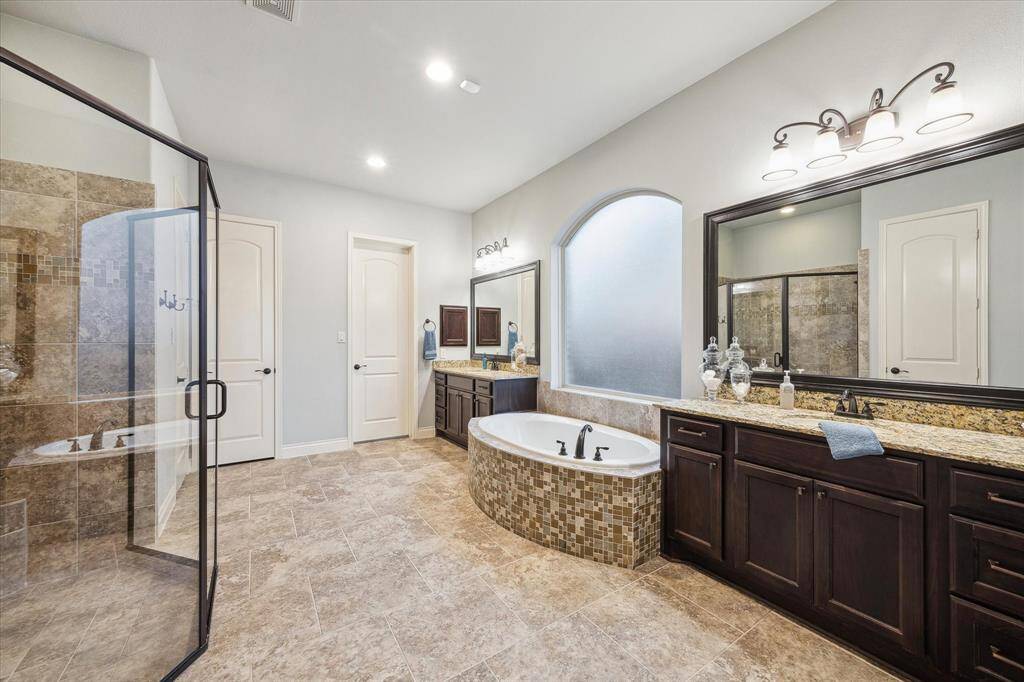 Primary bathroom with a seperate walk-in shower and soaking tub.