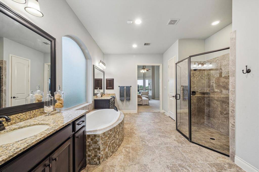 2 vanity sinks and lots of space throughout the primary bathroom.