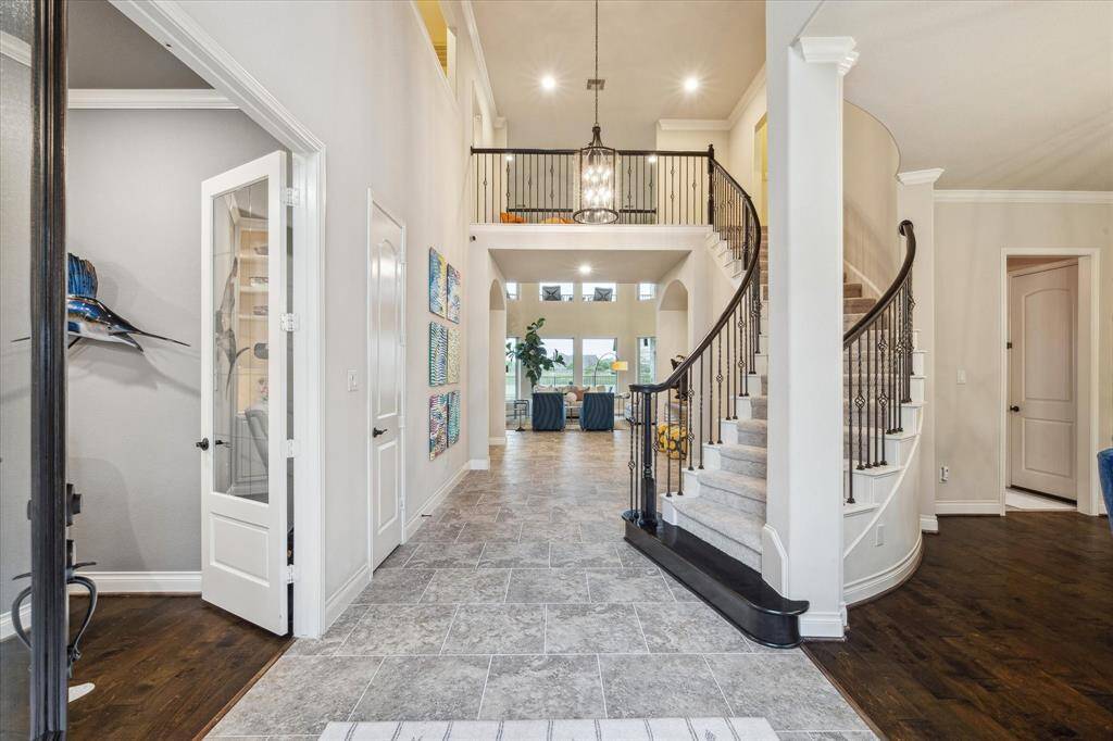 Step inside to a beautiful staircase and open entry way