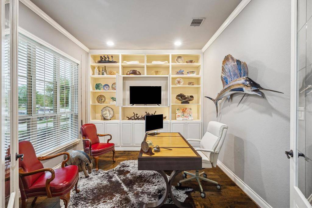 Home office/study right off to the left as you walk in with built in cabinetry