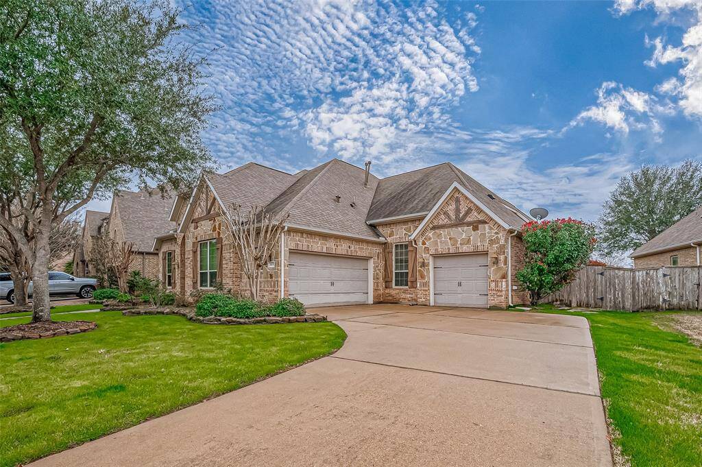This spacious driveway offers plenty of extra parking for guests or the perfect spot to set up a basketball hoop for some fun and games! THREE CAR GARAGE WITH EPOXY FLOORING.