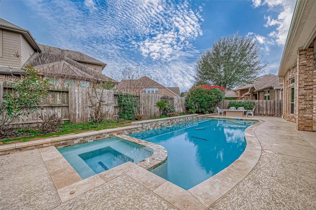 Unwind in the soothing spa before making a splash in the refreshing pool—your perfect backyard retreat for relaxation and fun.