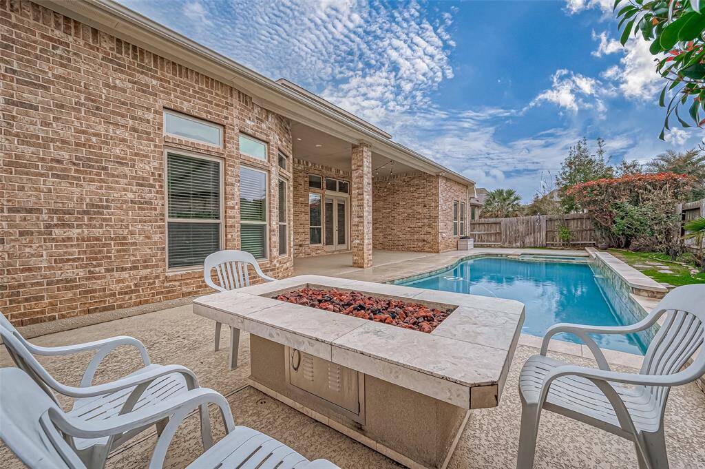 Your private backyard oasis! Take a refreshing dip in the sparkling pool, enjoy alfresco dining on the patio, and end the evening roasting marshmallows over the cozy outdoor fire table.