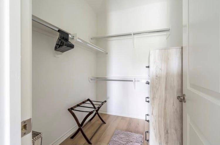 Primary walk-in closet off primary restroom
