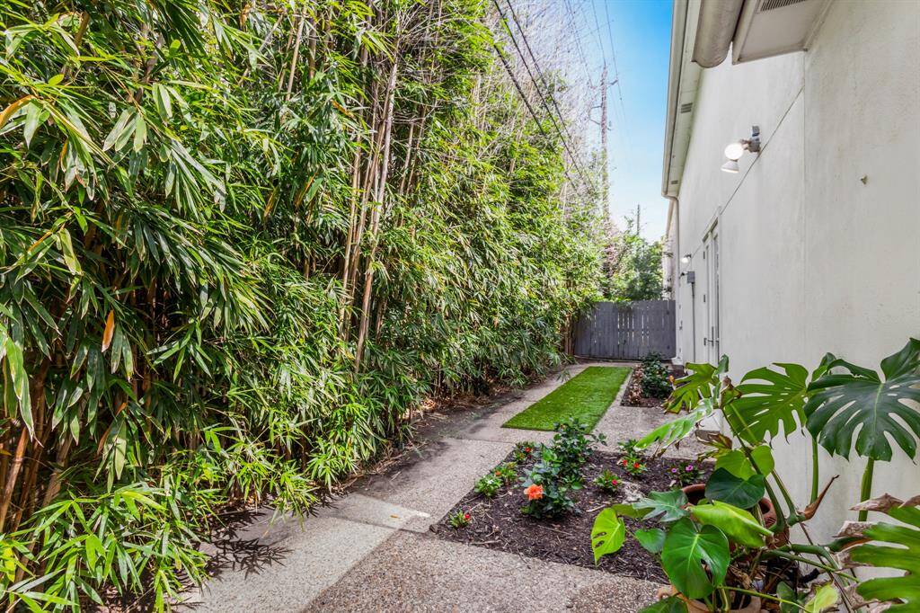 Lovely view of the back yard fully fenced offering an outdoor shed with electricity and AC.