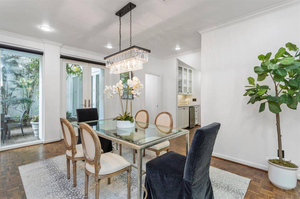 Dining room perfectly located near the living room and butler's pantry with crown molding, great natural light.