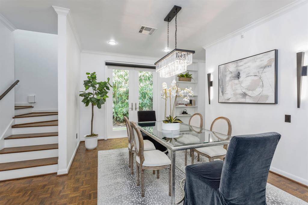 Dining room perfectly located near the living room and butler's pantry with crown molding, great natural light.