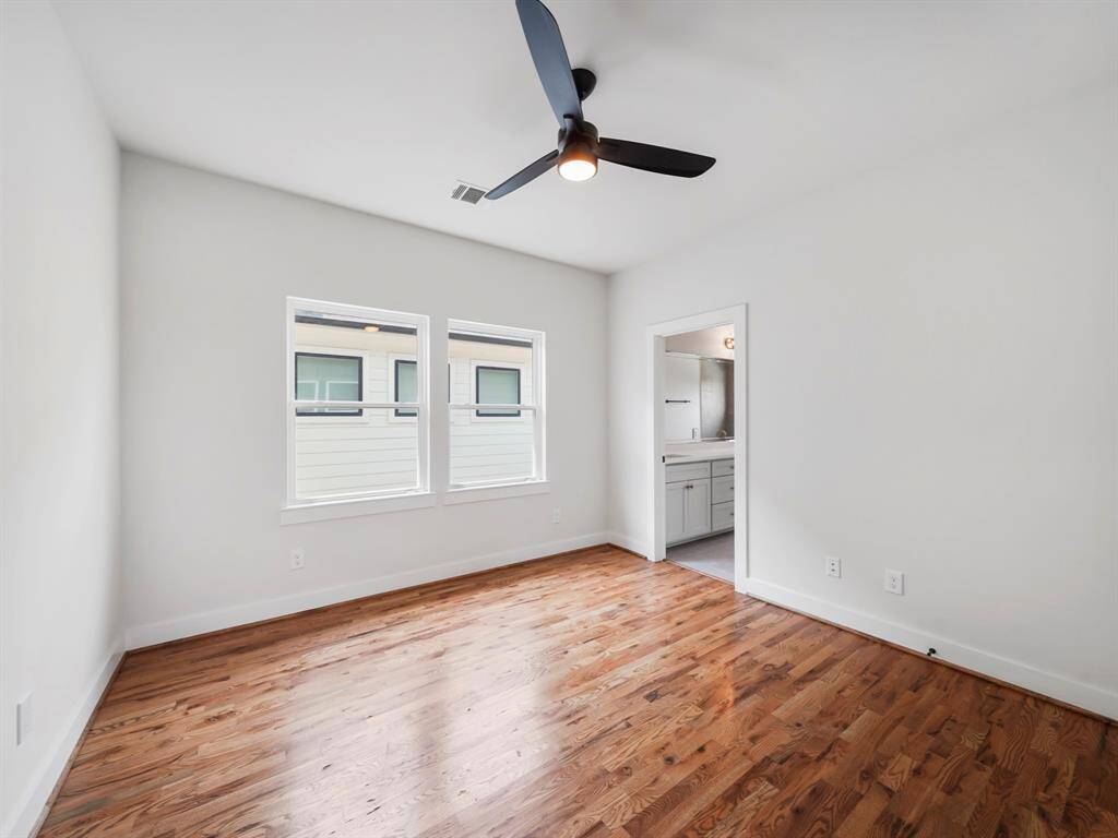 Bright and cozy secondary bedroom featuring ample space and natural light. This room shares a well-appointed Jack and Jill bathroom, offering convenience and privacy for guests or family members. Thoughtful design and ample closet space make this room both functional and comfortable.