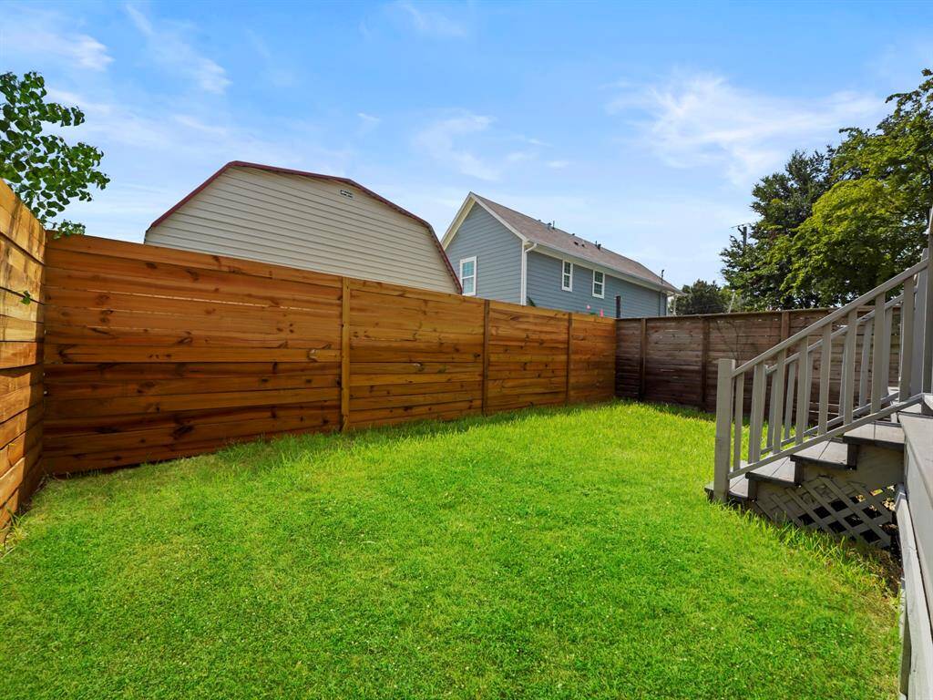 Private, fenced-in backyard offering a secure and spacious outdoor area. Perfect for pets, play, or entertaining, this yard provides a safe and tranquil environment with plenty of room for outdoor activities, gardening, or relaxing in your own private retreat.