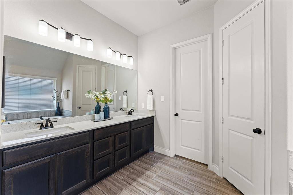 The double vanity provides plenty of space for two with room to spare.