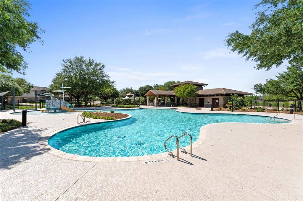 The sparkling community pool offers a refreshing retreat on sunny Texas days.