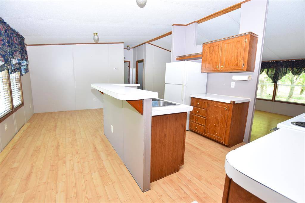 The kitchen is thoughtfully enclosed, providing both privacy and functionality.