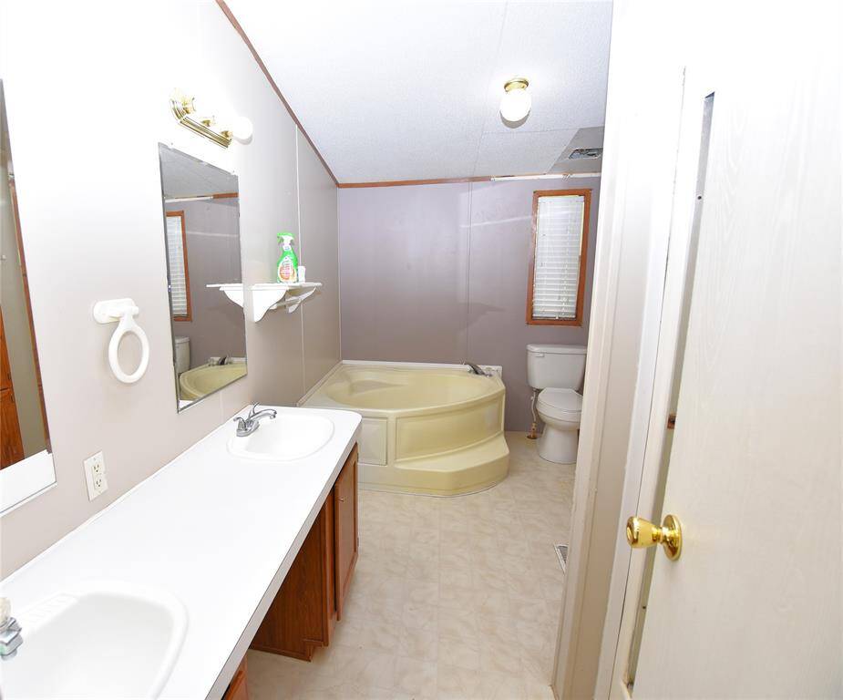 Whether you’re preparing for the day or winding down in the evening, this primary bathroom is your personal sanctuary.