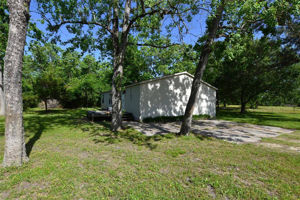 Whether enjoying the quiet in the backyard or gazing out from the windows, the mature trees provide a perfect, serene escape, adding both charm and a touch of elegance to the property.