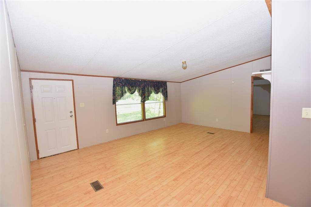 The generous layout provides plenty of space for comfortable seating and makes the living room the perfect spot for both relaxing and entertaining.