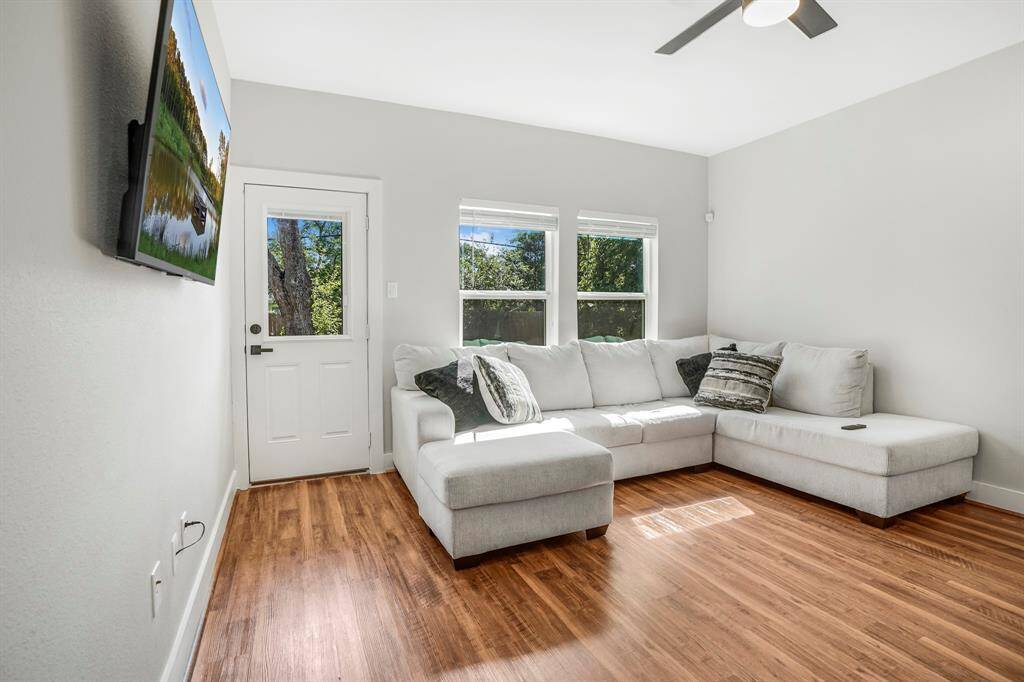 Light and bright living area. Beautiful view to the back yard.