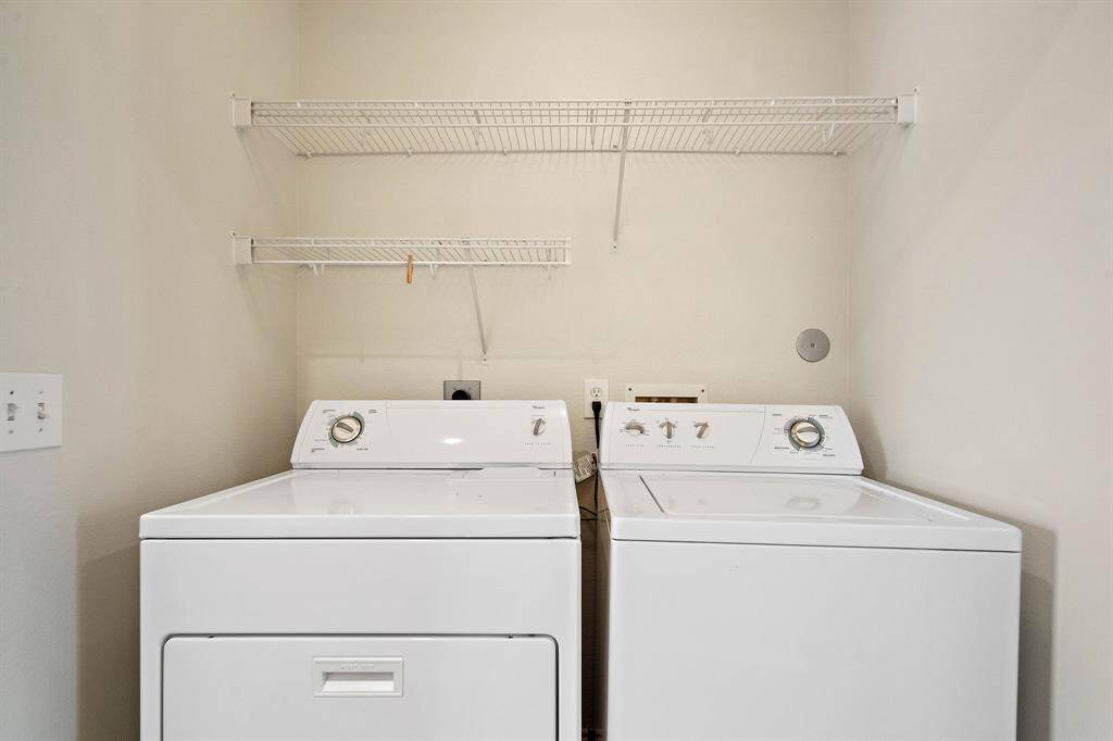 Utility room located on the 2nd floor. Washer, dryer, and refrigerator included.