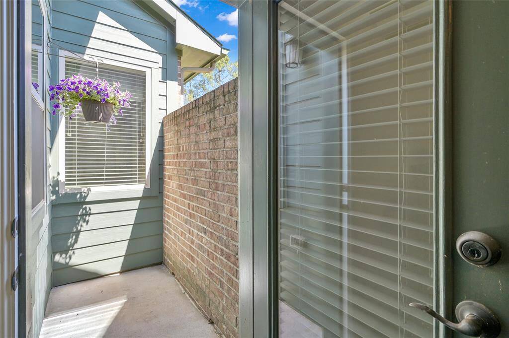 Located in the office, this small outdoor area offers a cozy, private space to step outside and relax.