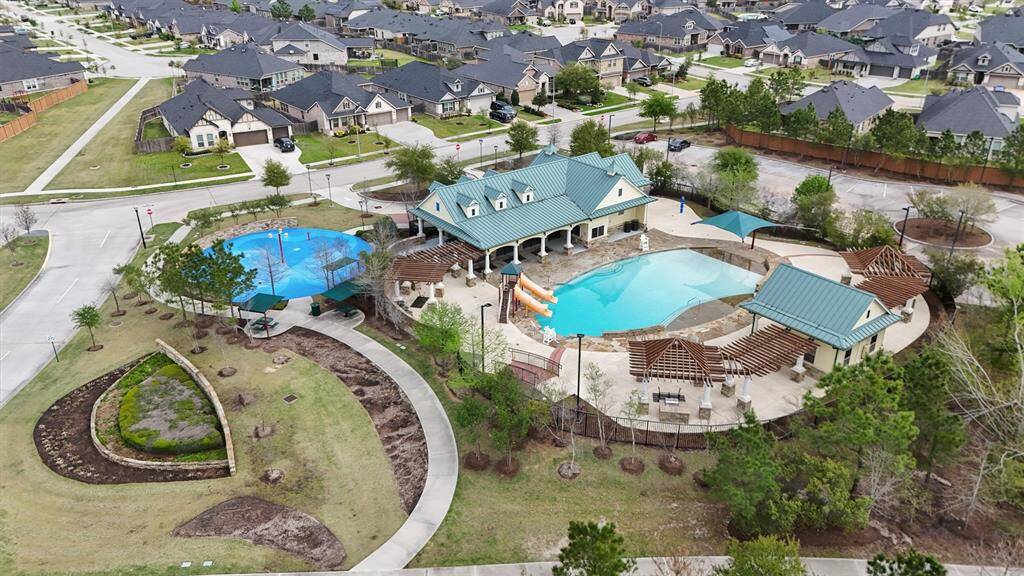 The second community recreation center is a 3,200 square foot oasis featuring a pool with beach entry, splash pad, an outdoor patio with shade arbors, covered pavilions and a fire pit as well as several grilling areas. Across the street is a park, including nature trails, seating areas and a soccer/ball field.