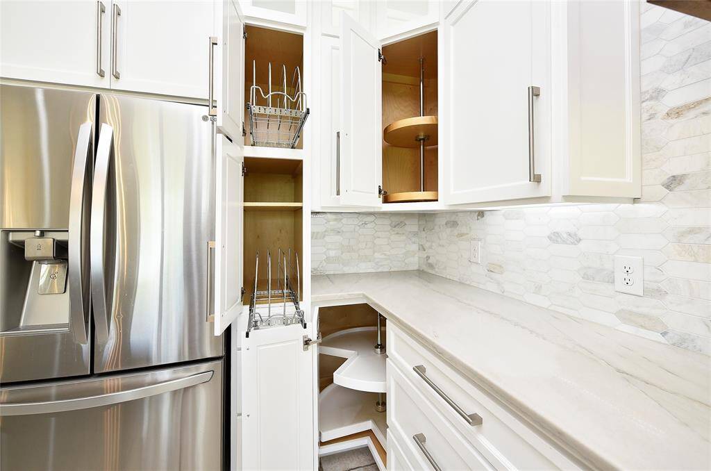 This view of the kitchen shows the breakfast area and apron sink.