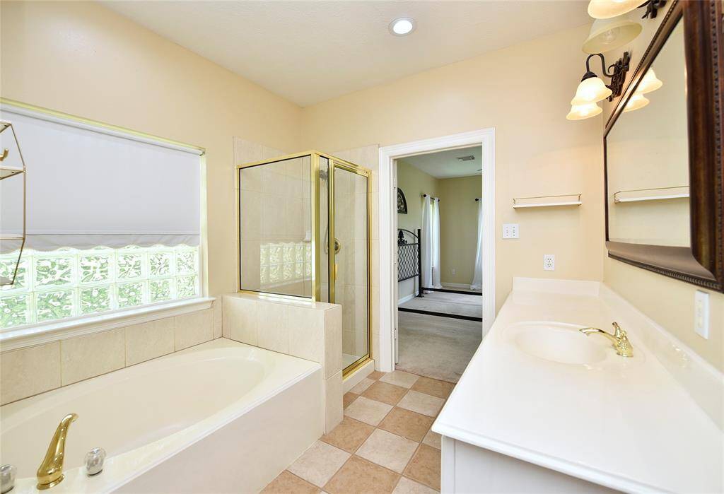 This bathroom is in the laundry room. The shower is ideal for those working/playing outside before going through the house.