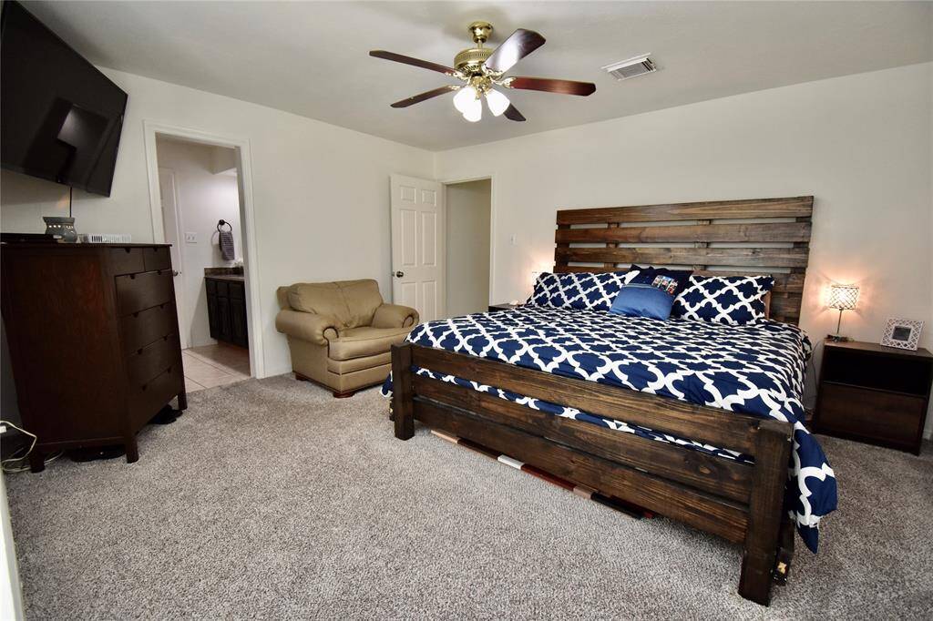 Another view of the primary bedroom.