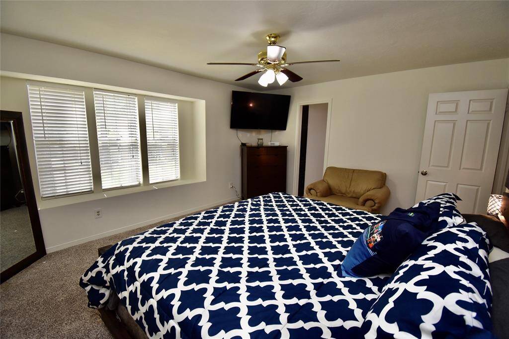 Another view of the primary bedroom.