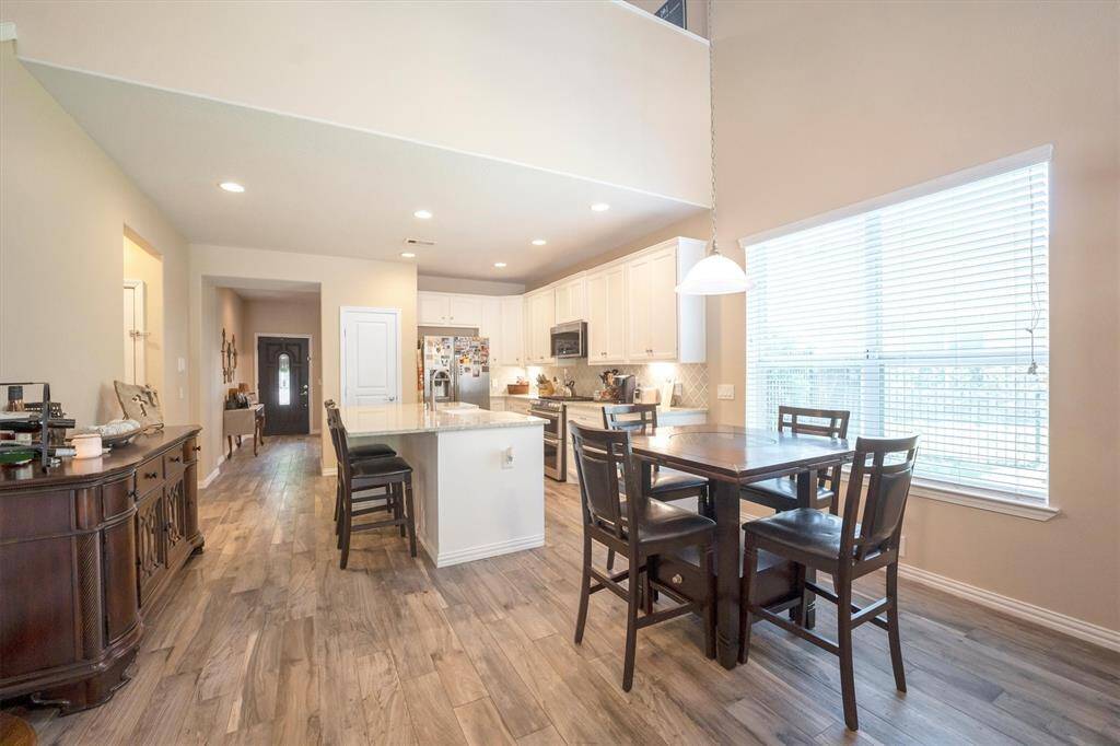 Gather them around your table to honor old traditions and create the new. This open elegant dining room offers the perfect backdrop to celebrate any occasion.
