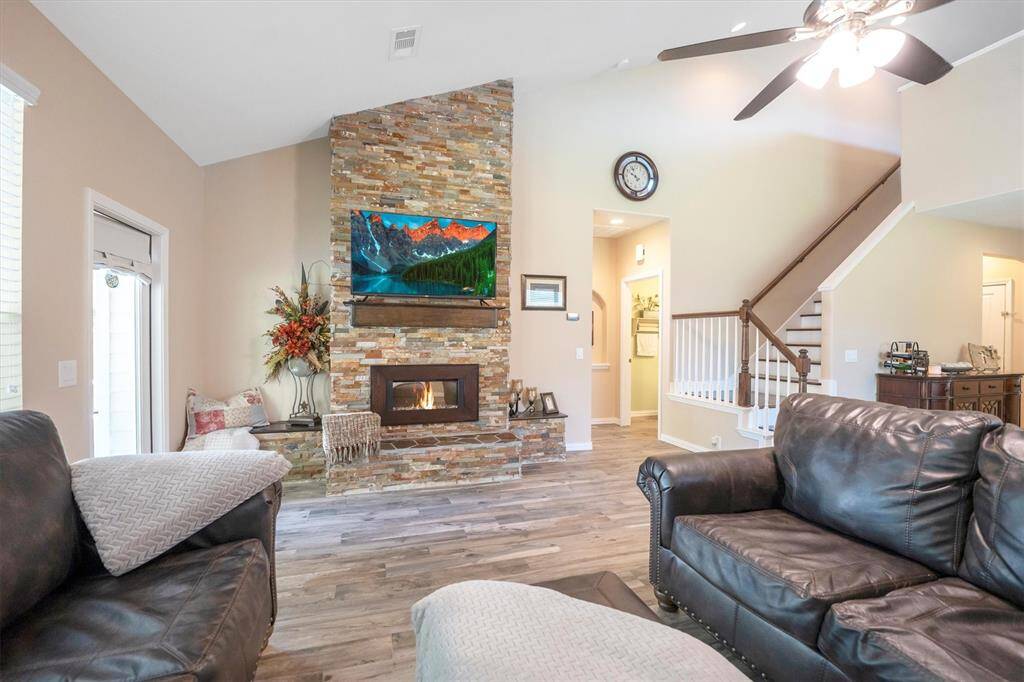 Gather by the fire and enjoy cozy evenings filled with laughter and lively conversation. With room for everyone to relax and a striking stone fireplace as the centerpiece, this family room is the perfect place to make lasting memories.