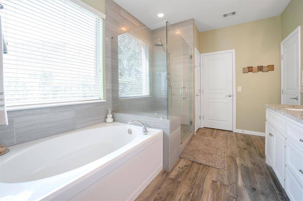 Relax and soak your worries away in this luxurious soaking tub or enjoy a refreshing rinse in the walk-in shower with frameless glass. Either way, you're going to love this private sanctuary.