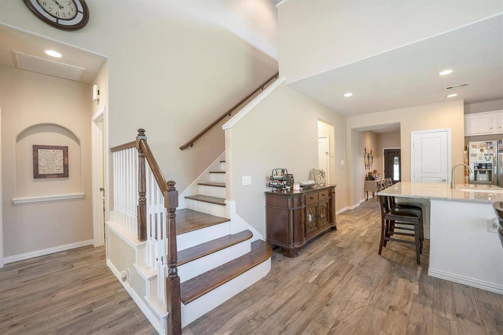 Head upstairs to find a spacious game room, three comfortable bedrooms, and a full bathroom—plenty of room for family, guests, and fun!