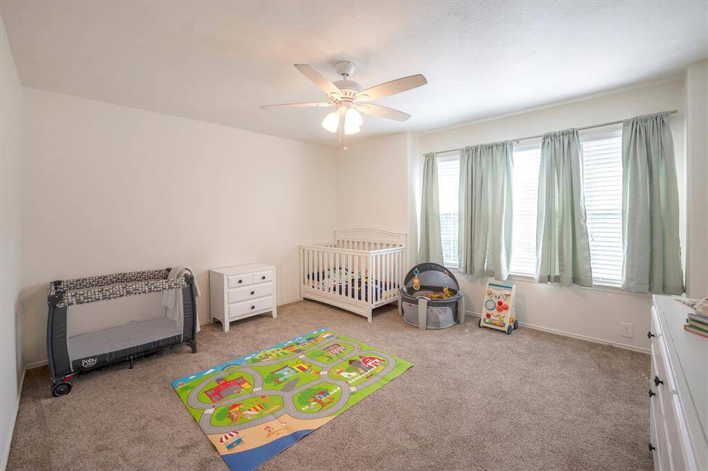 With three very spacious guest rooms upstairs, you will always have room for company. This roomy bedroom offers soft neutral finishes, a lit fan, large closet and easy access to a full bathroom.