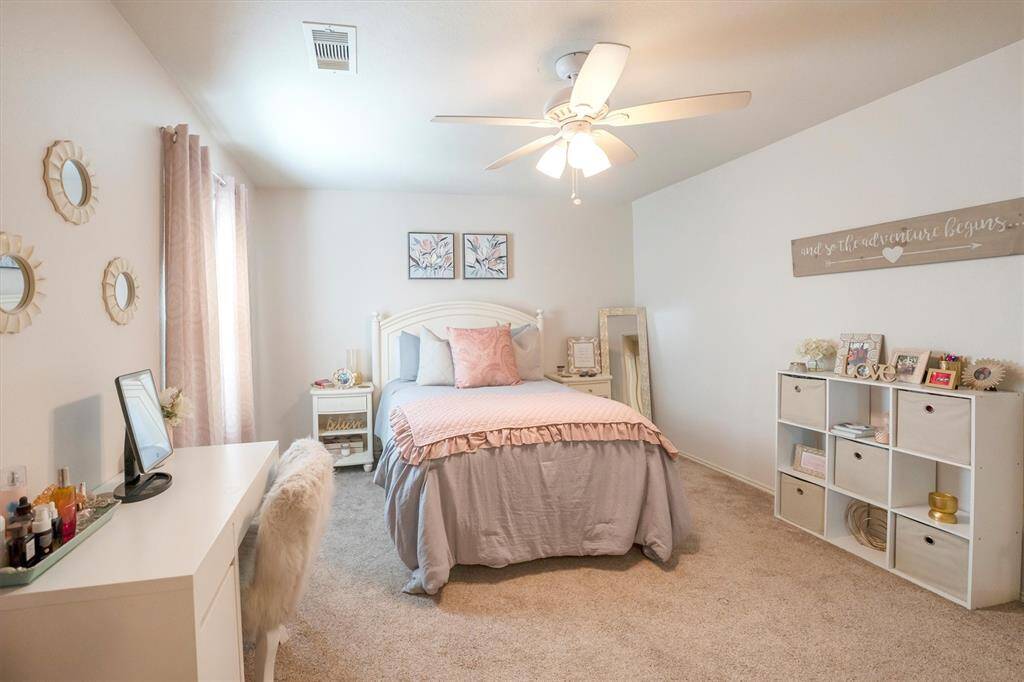 An alternate view of the charming guest bedroom shows plenty of space for furniture, games, toys and more.