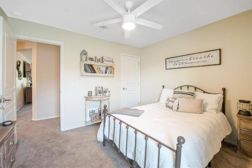 Bright, welcoming, and full of potential, this guest bedroom offers plenty of space to settle in and make it your own. Soft neutral tones set the stage for comfort and relaxation.