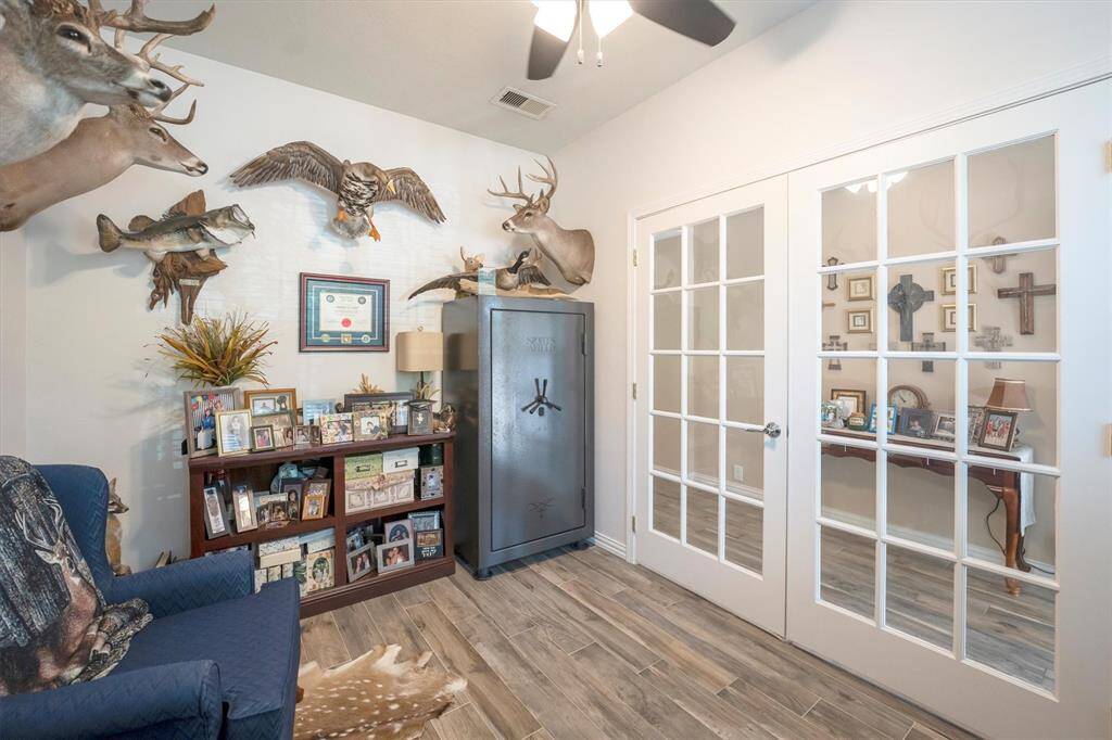 Tucked behind French doors just off the foyer, this private study offers the perfect space for your home office. With all the privacy you need to make phone calls or attend online meetings or virtual classes.