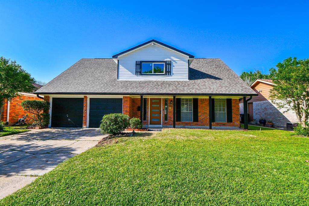 Welcome to this charming two-story home featuring a classic brick exterior with black shutters and a welcoming front porch. It includes a double garage, and a well-maintained lawn, and is situated in a quiet neighborhood. Ideal for families seeking a comfortable and attractive living space.