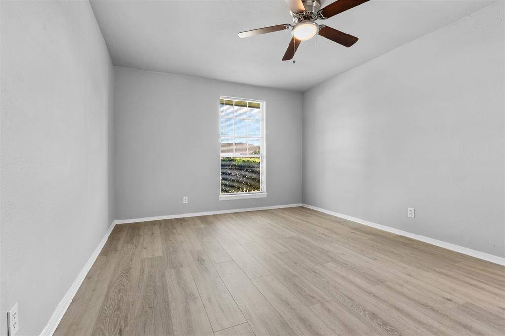 Primary Bedroom with street facing window for lots of natural lighting.